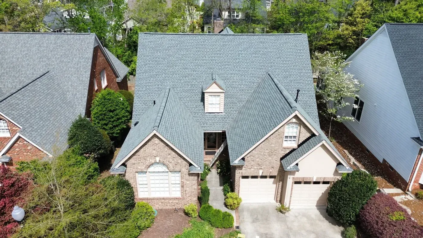Completed roof replacement with Slate GAF Timberline HDZ shingles on a brick home in Raleigh, NC
